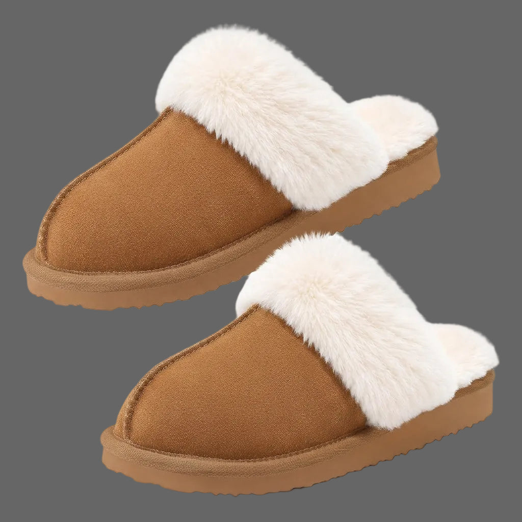 A pair of slip-on mule slippers with a warm brown suede-like upper and thick white faux-fur trim