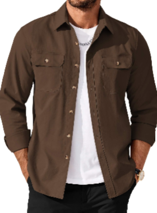 A man wearing a brown long-sleeve button-up shirt over a white t-shirt and black pants, shown from the waist up against a plain white background.