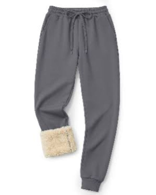 Gray fleece jogger pants with a beige sherpa lining visible at the hem, featuring an elastic waistband with a drawstring.