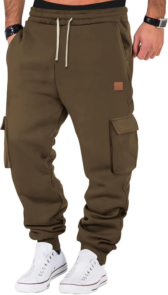 A person wearing khaki cargo jogger sweatpants with white sneakers, shown from the waist down against a plain white background.