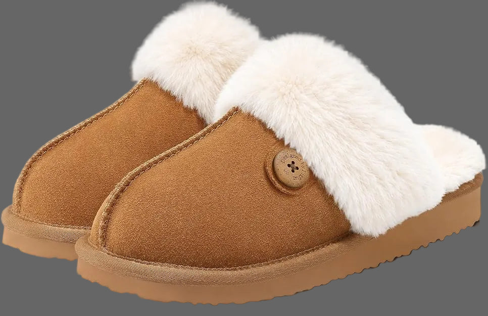 A pair of tan suede slip-on slippers with fluffy white faux-fur trim and a decorative button detail on the side